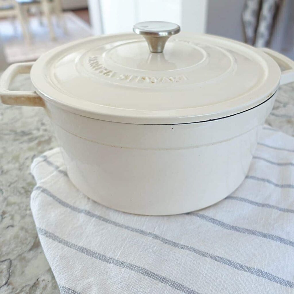 how to clean enameled cooware white martha stewart dutchoven with striped tea towel