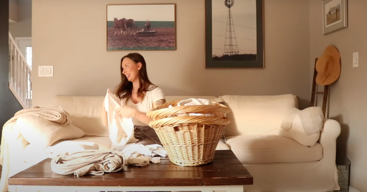 from six figure corporate career woman to homemaker folding laundry