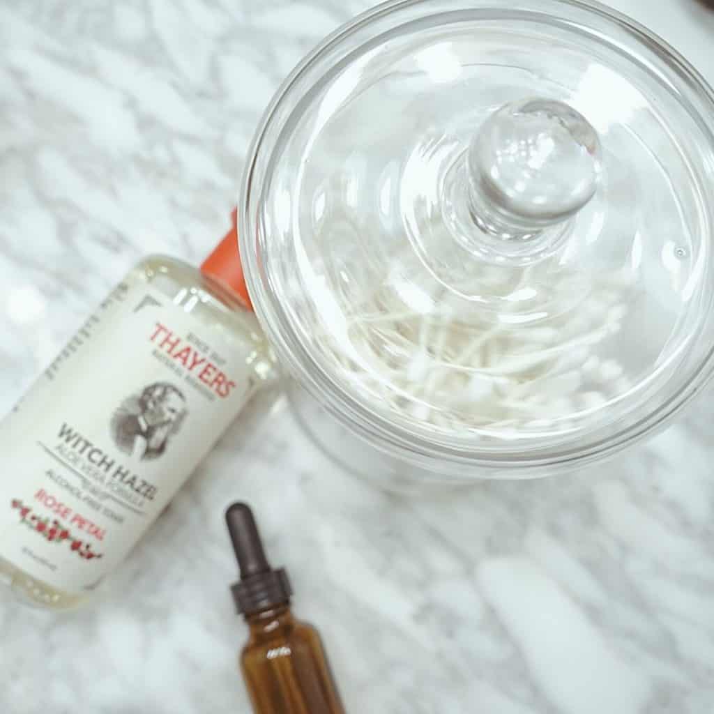 thayers witch hazel an amber dropper jar and glass jar with q tips