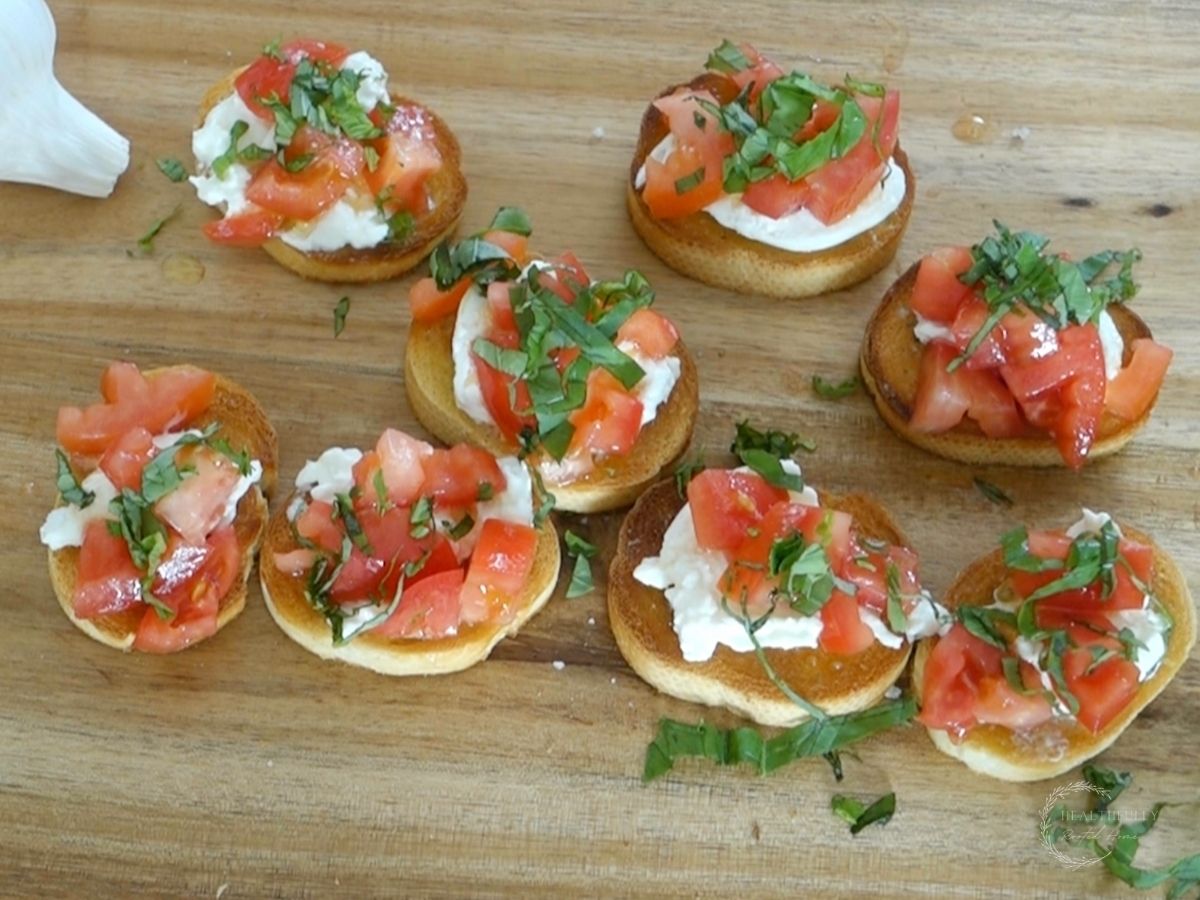 burrata bruschetta italiana topped with fresh basil