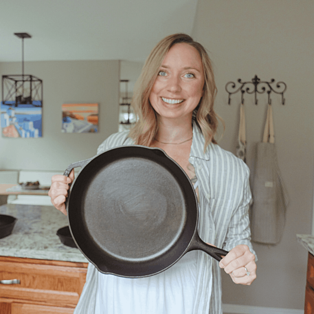 healthfully rooted home kyrie holding a nonstick cast iron skillet