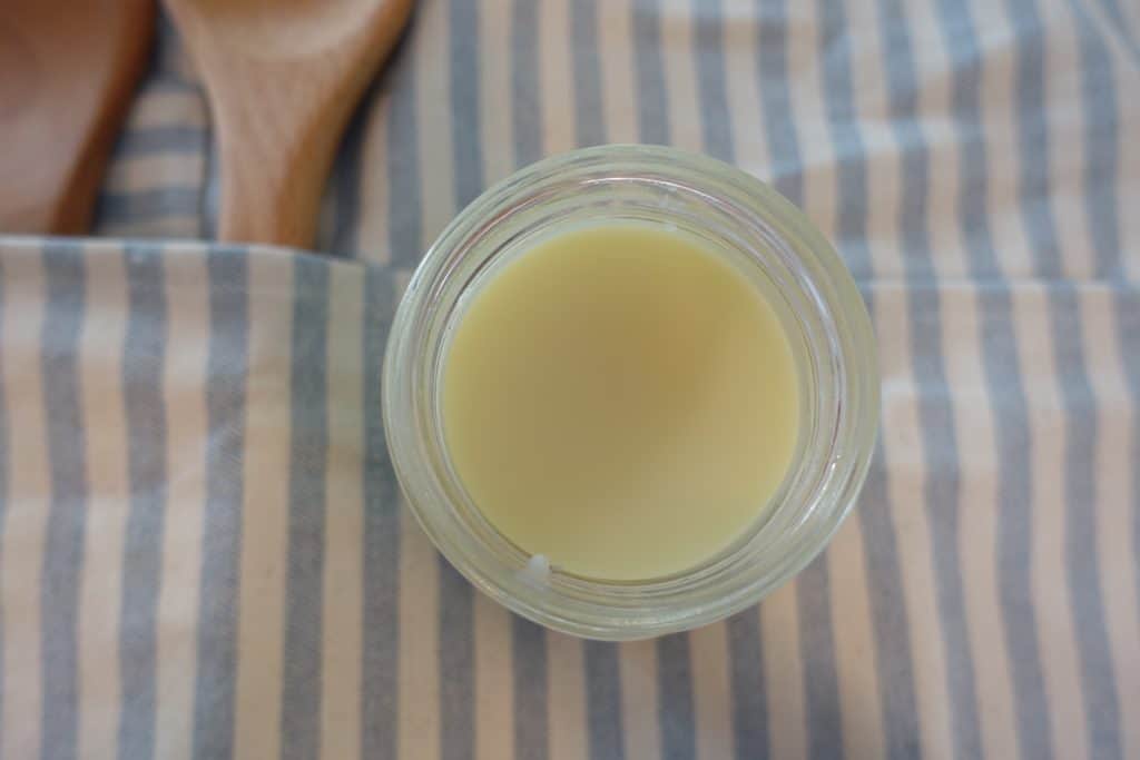 homemade healthfully rooted home wood butter to season wooden spoons on top apron 