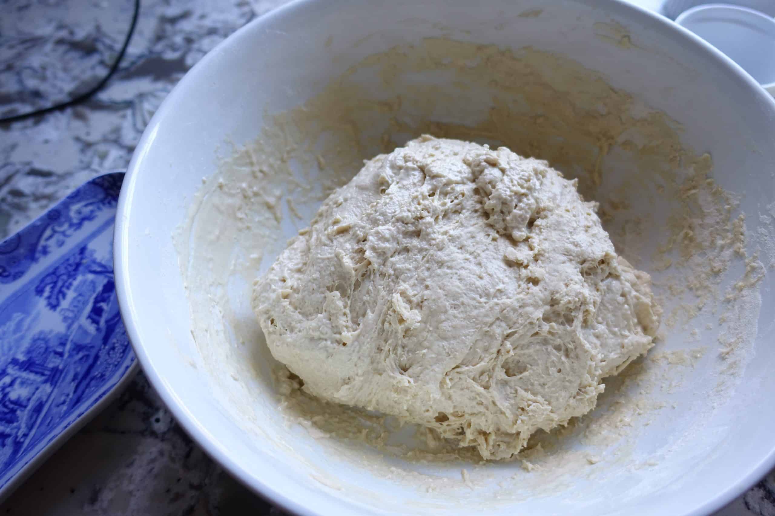 sourdough resting after mixing sourdough starter and salt into the hydrated flour