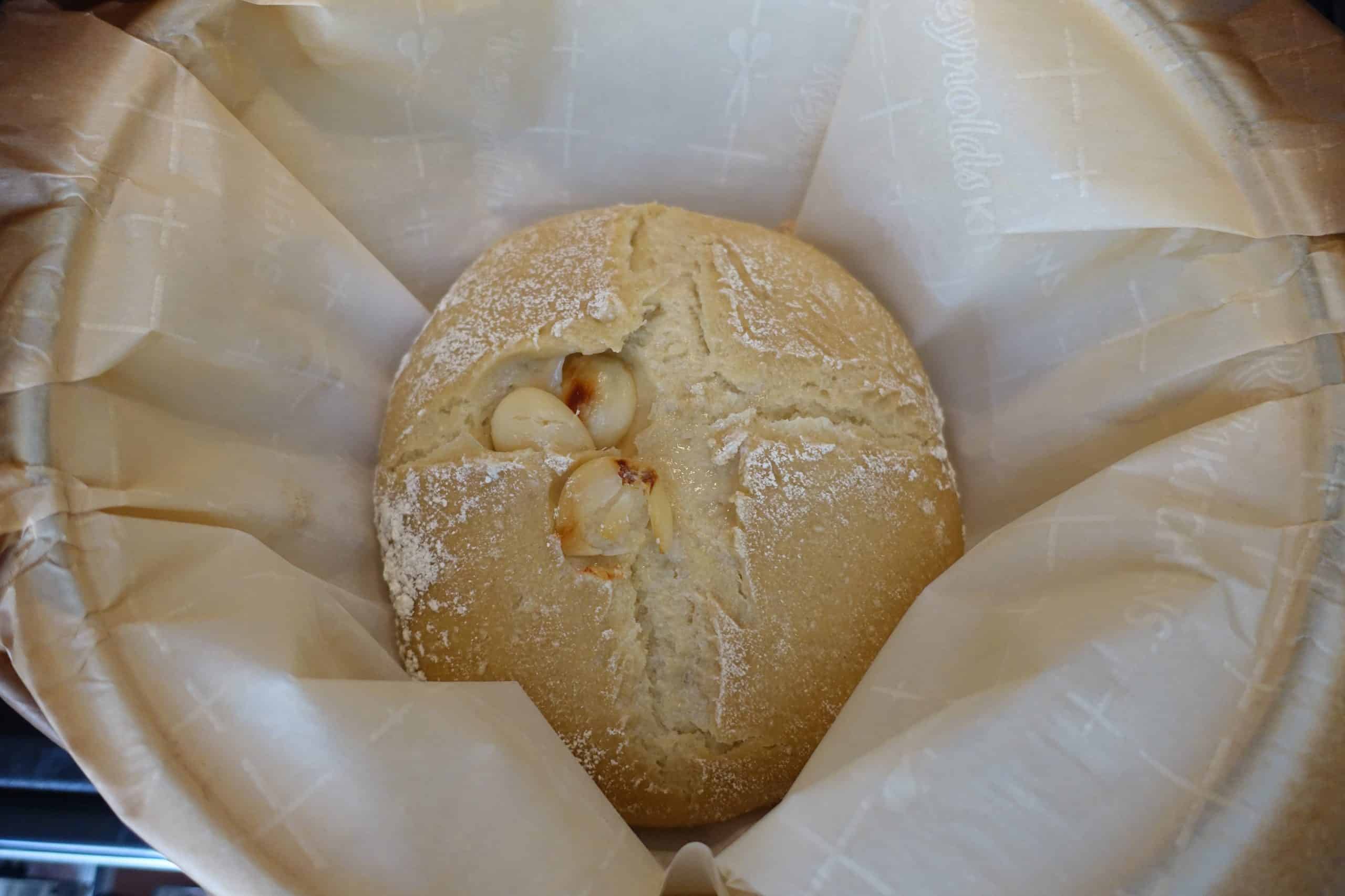 roasted garlic sourdough bread in dutch oven before the last bake and browning