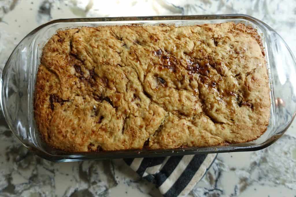 cardamom sourdough bread in loaf pan before second rise