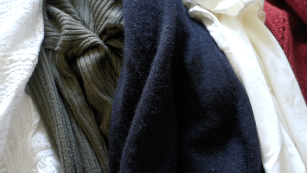 how to avoid a cluttered closet by using a capsule wardrobe system.