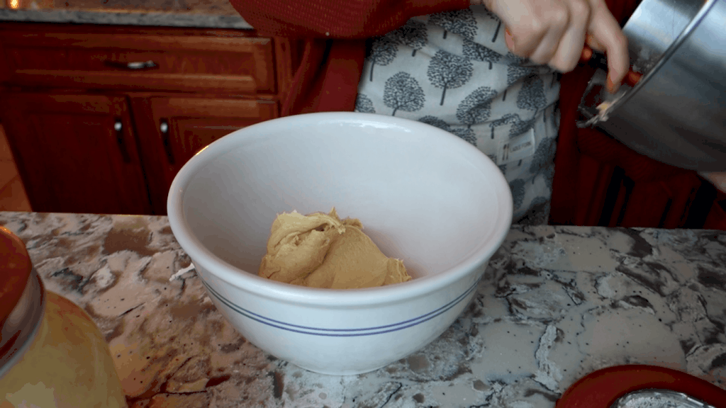 letting cardamom sourdough bread dough rise in a bowl