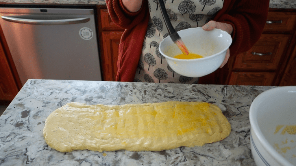 washing the sourdough with egg wash
