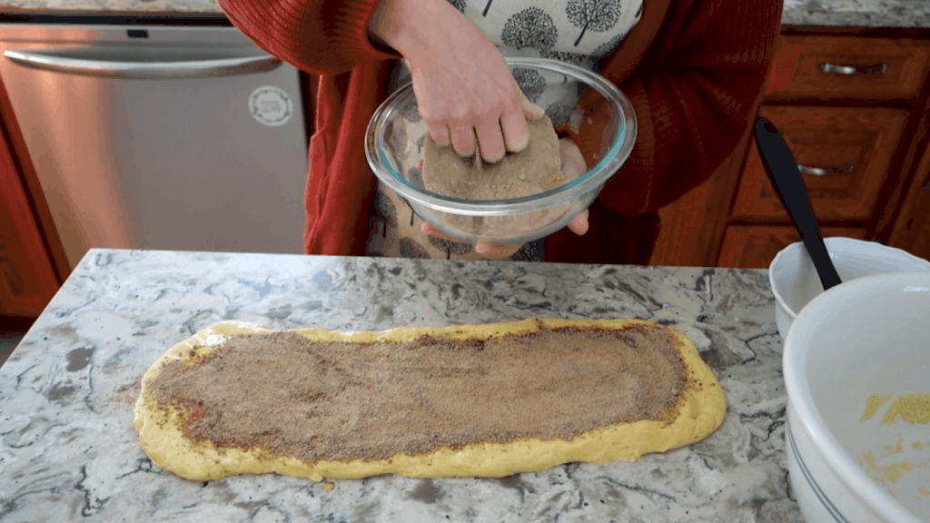 placing the cardamom cinnamon filling inside the sourdough