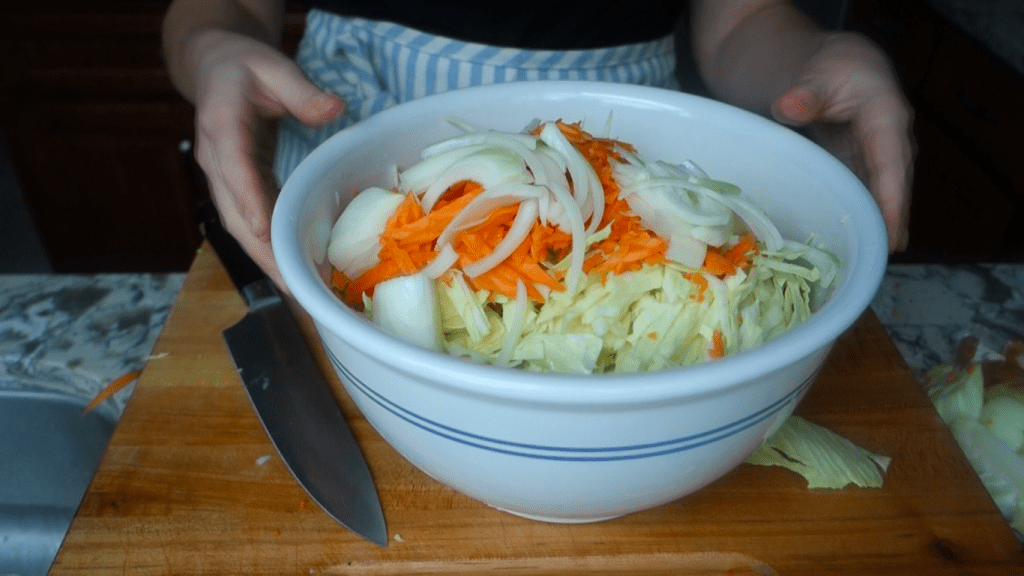 all vegetable ingredients for curry kraut in a non reactive ceramic bowl