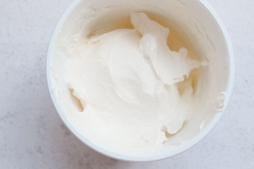 container of sour cream to show it's use as an applesauce substitue