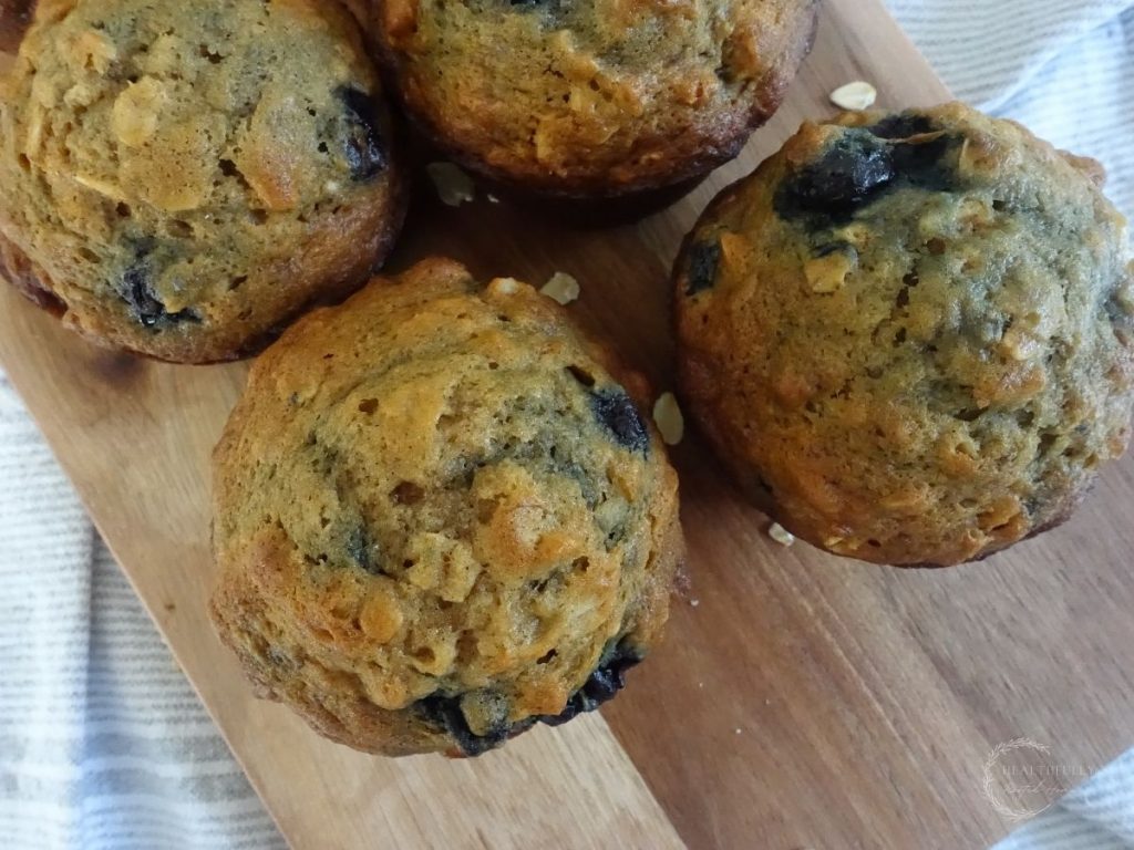 a couple banana blueberry oatmeal muffins being served