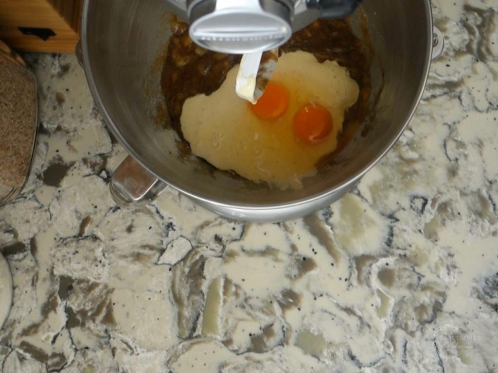 eggs and sourdough discard added to the banana and sugar mixture in a stand mixer