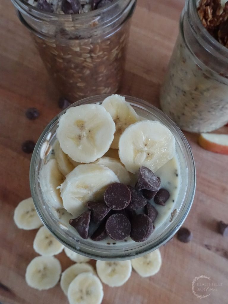 high protein overnight oats in a jar topped with bananas and chocolate chips