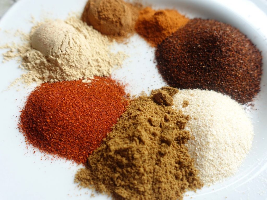 plate with all the spices for low sodium taco seasoning in piles