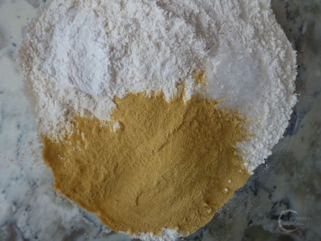 dry ingredients used to make boobie biscuits in a bowl ready for mixing
