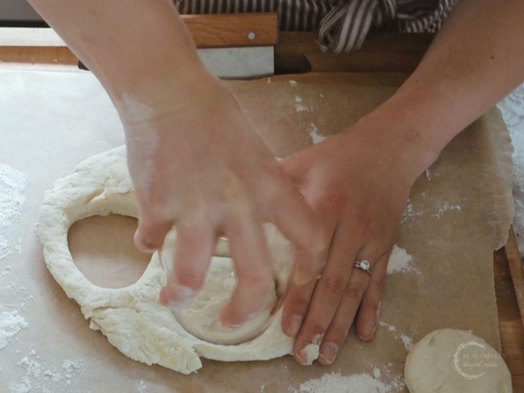 using a wide mouth wine glass to cut the scones dough
