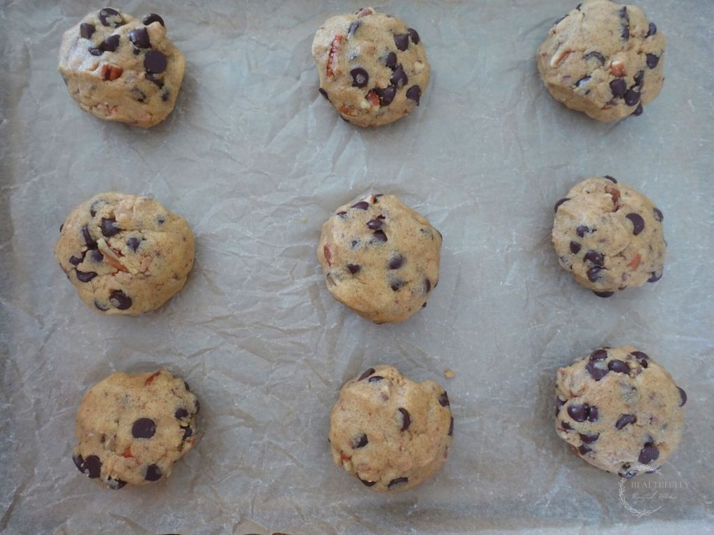 cookie dough balls on a baking sheet