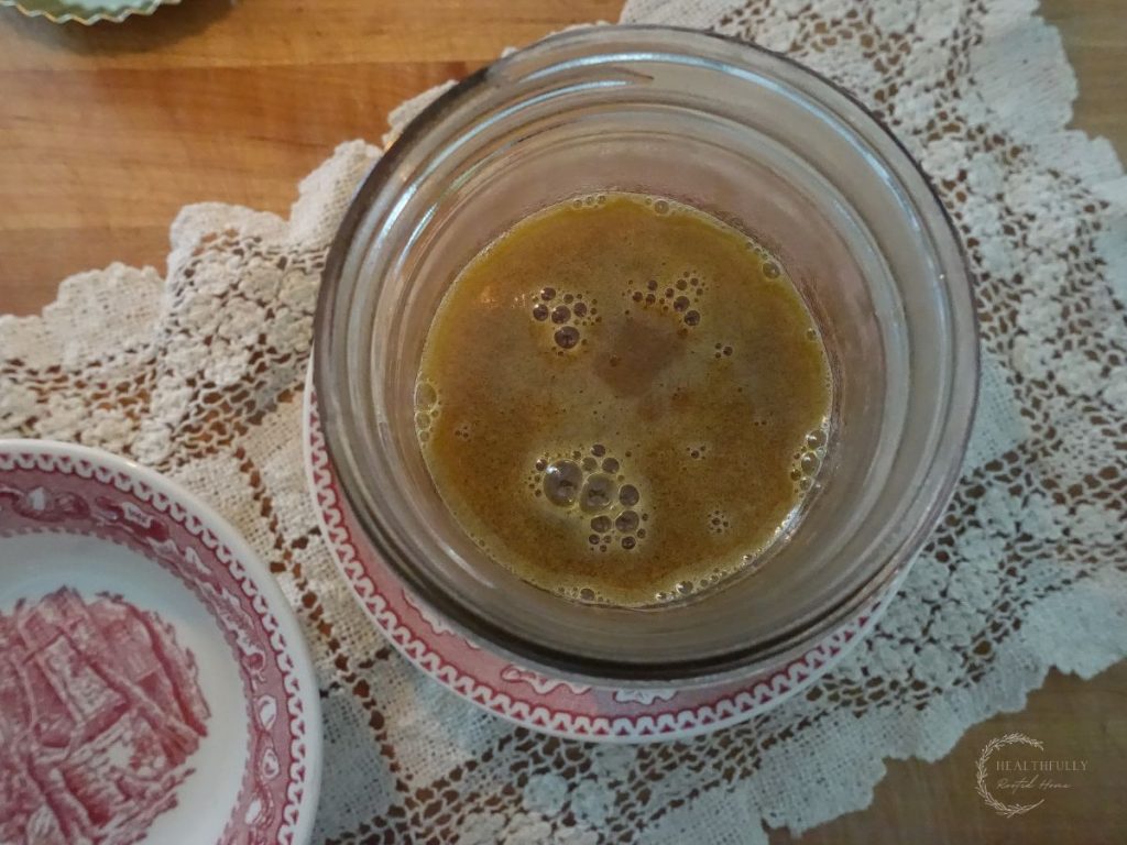 salted caramel sauce in a mason jar cooling down and thickening