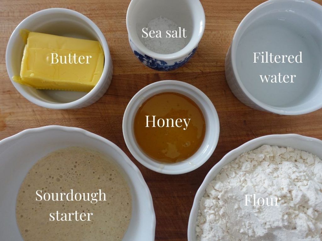 sourdough breadsticks ingredients in white jars and labels so you can see what each is