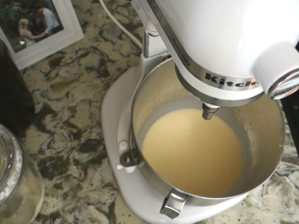 sourdough starter and sugar and water mixed together in a stand mixer to make zaatar bagel dough