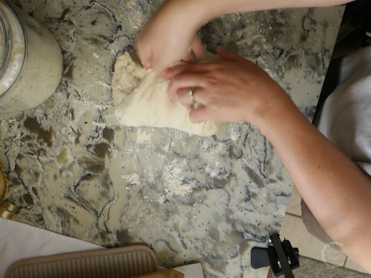all sides of sourdough discard dough brought into the center