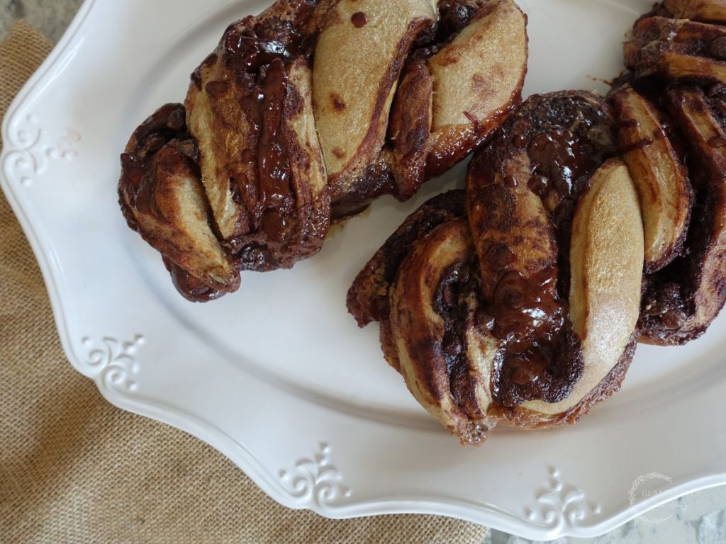 sourdough babka with chocolate filling on a white serving platter