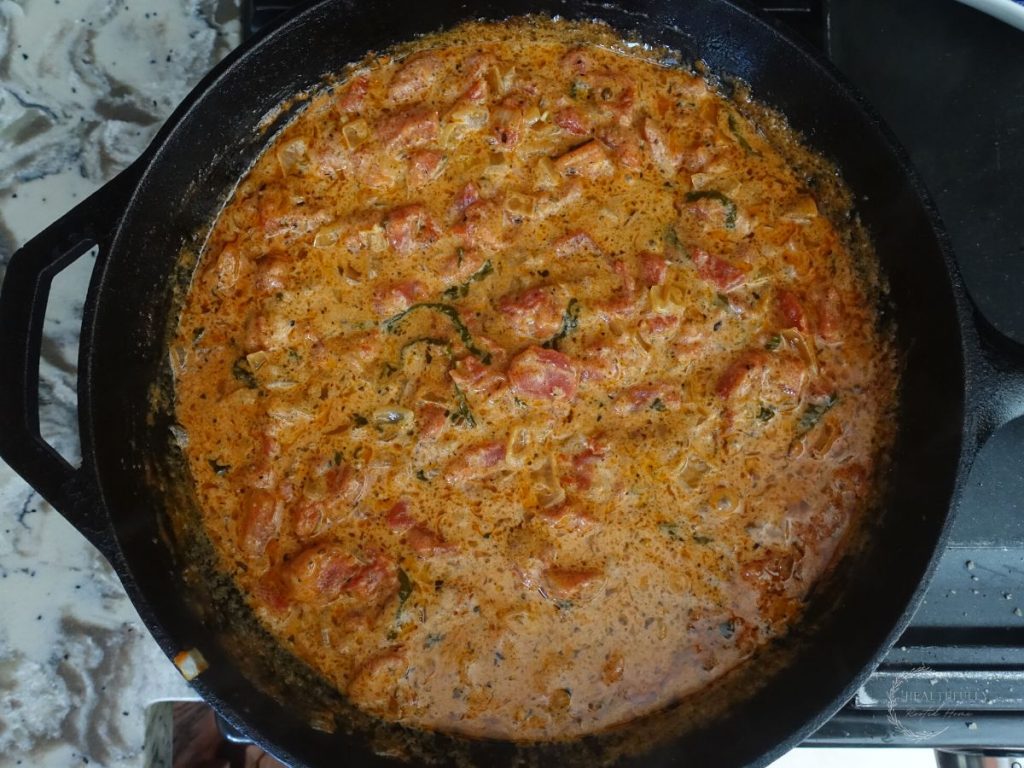 finished tomato mascarpone sauce in a cast iron skillet