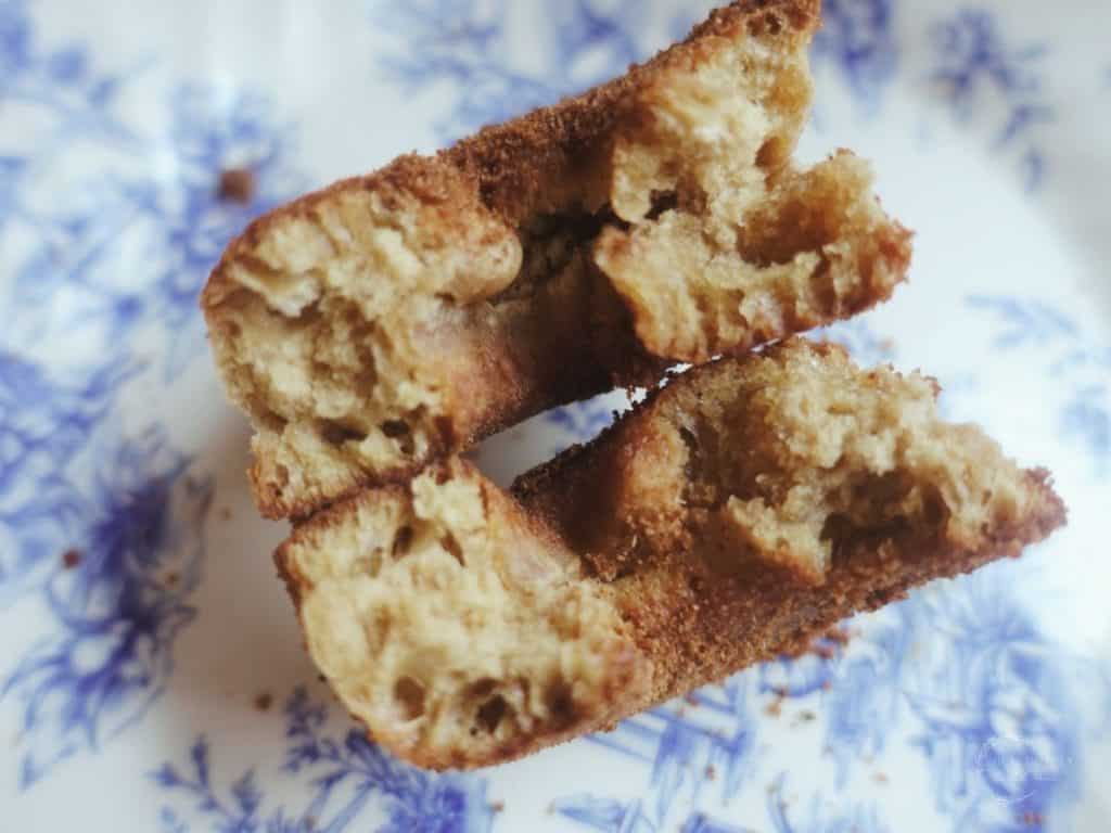 sourdough donut cut in half on a blue and white plate