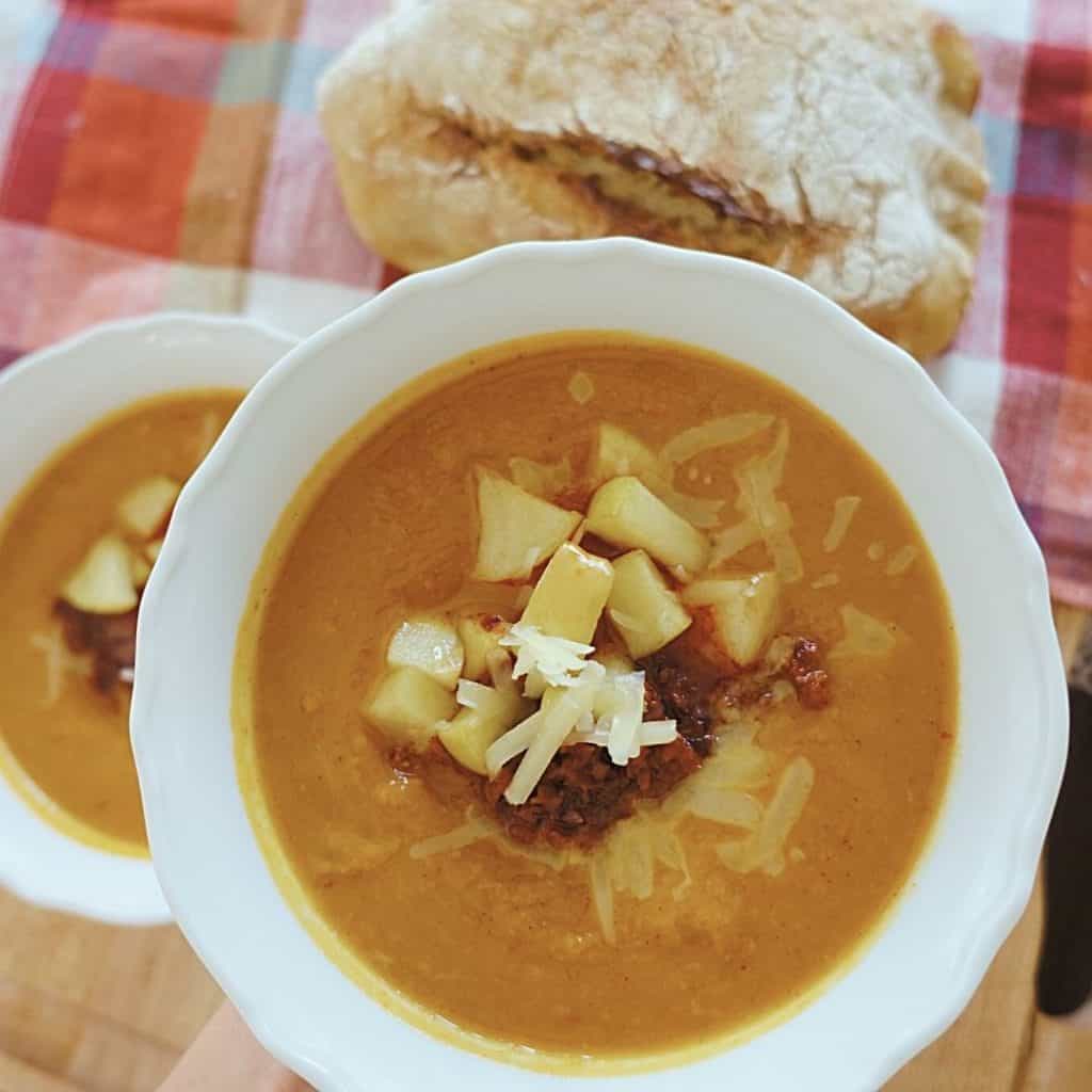 heart healthy chili with glazed apples cheddar cheese spiced pumpkin crispy chorizo and sourdough bread