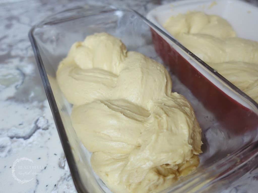 braided dough in a loaf pan