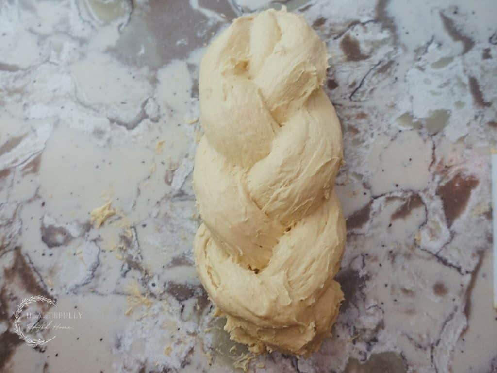braided einkorn sourdough on a granite countertop