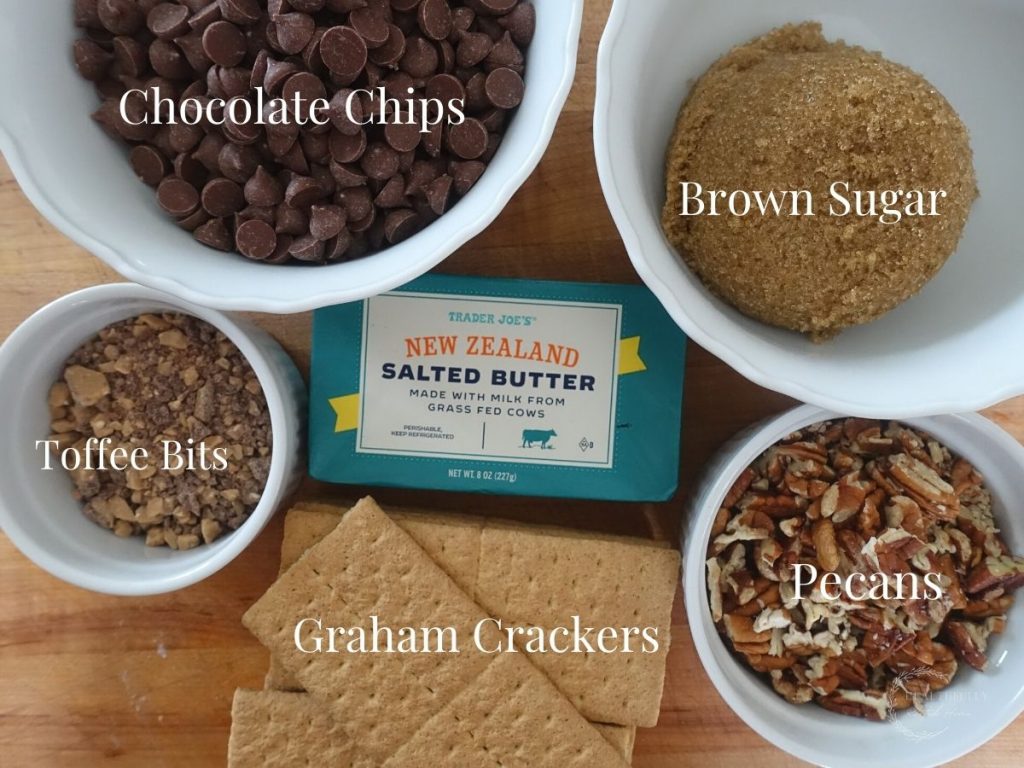ingredients in white bowls with labels naming what they are