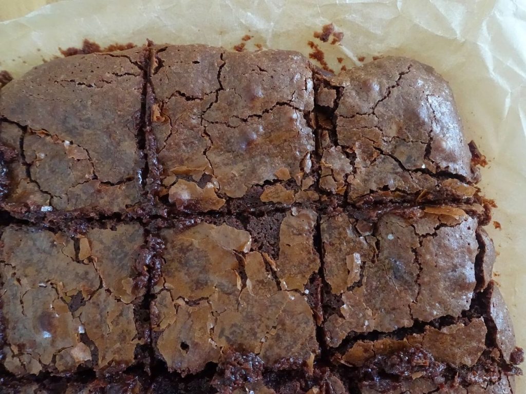 edge of crinkle top brownies baked and sliced