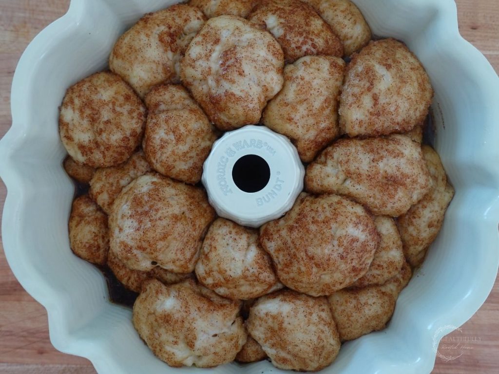 sourdough monkey bread dough in a bundt pan after proofing for 2 hours at room temperature