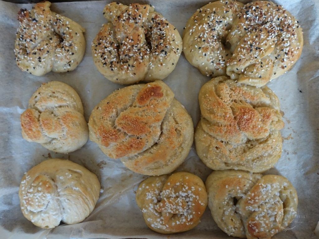 sourdough pretzels on a baking sheet after being baked